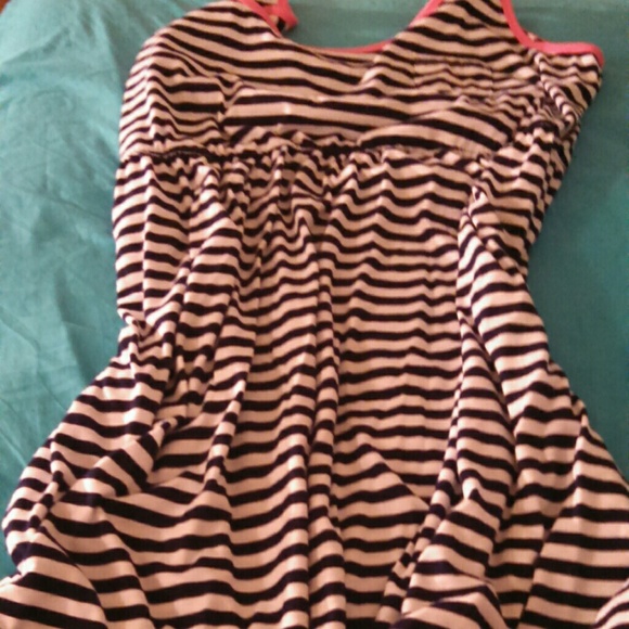 A white and blue striped dress with pink on top.
