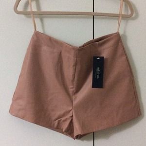Blush colored faux leather shorts from Arc & Co.