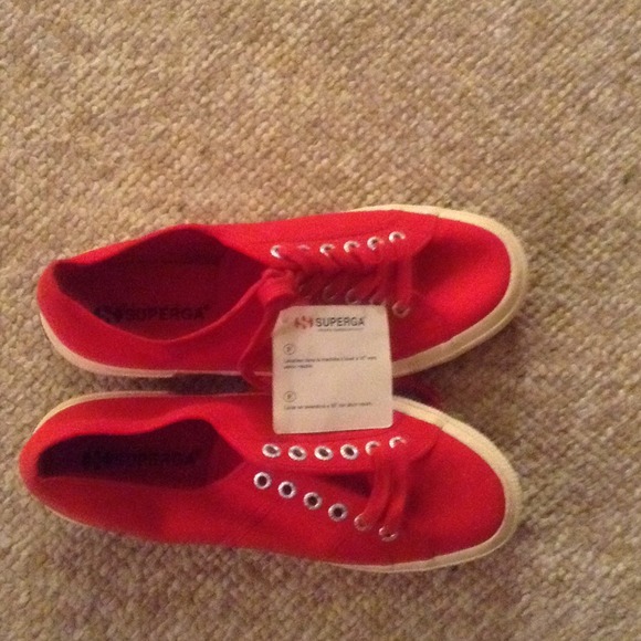 Red laced tennis shoes