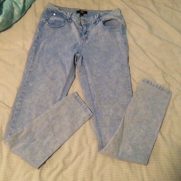 Acid washed pale blue jeans