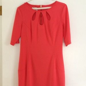 Very slimming size 10 orangey- pinkish dress.