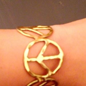 Gold peace sign bracelet