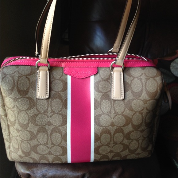 Slightly used Coach satchel brown w pink stripe