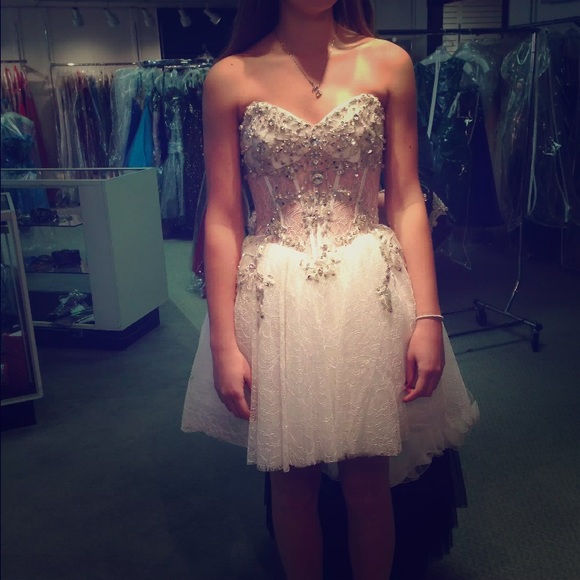 Short, off white, soph senior dress. Needs to go!