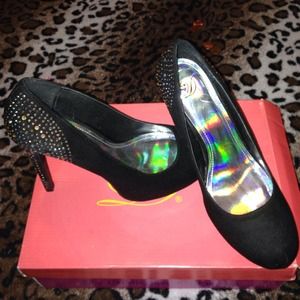 Black heels with a bedazzled back