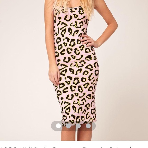 SOLD! body conscious dress in colored leopard.