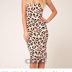 SOLD! body conscious dress in colored leopard.