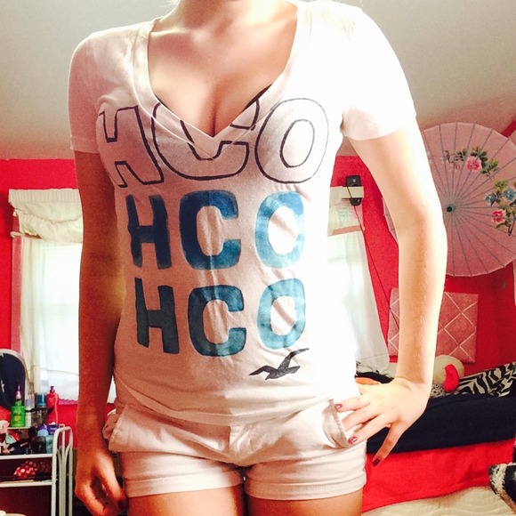 Hollister White V-Neck With Blue Lettering.