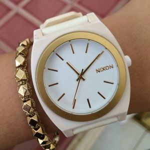 Nixon white and gold watch.