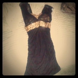 This is a night dress. It's short, black and gold.