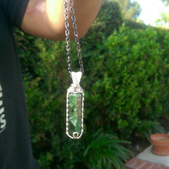 Hand made wire wrapped seraphinite gem stone.