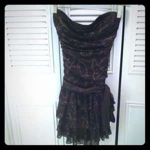 Short brown ruffle dress w/ copper glitter & bow.