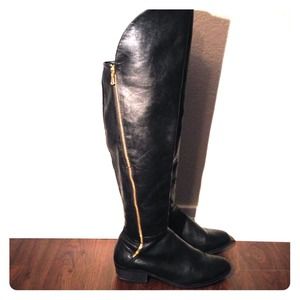 Report over the knee black boots
