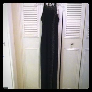 Beaded black open-back gown w/ slit.