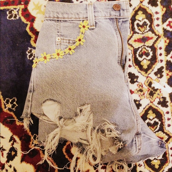 High waisted shorts with daisies on the pockets.