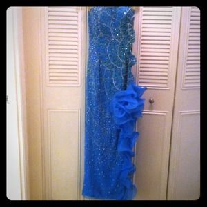 Aqua beaded sequin high slit ruffle cut out gown.