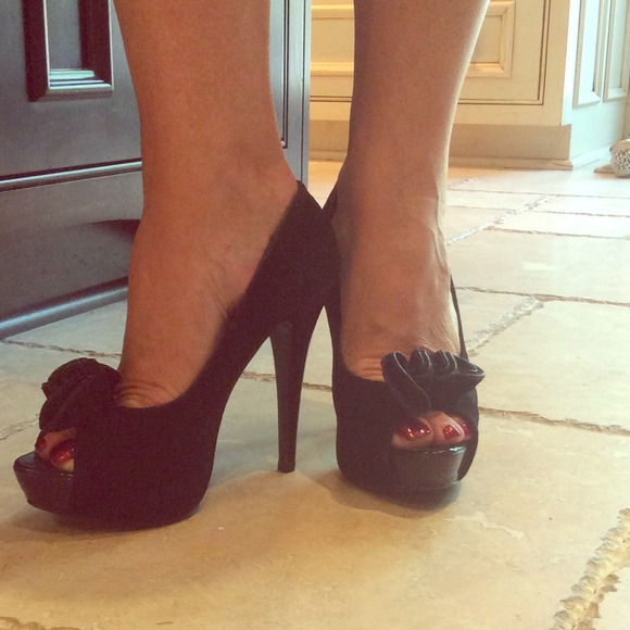Black suede peep toe pumps