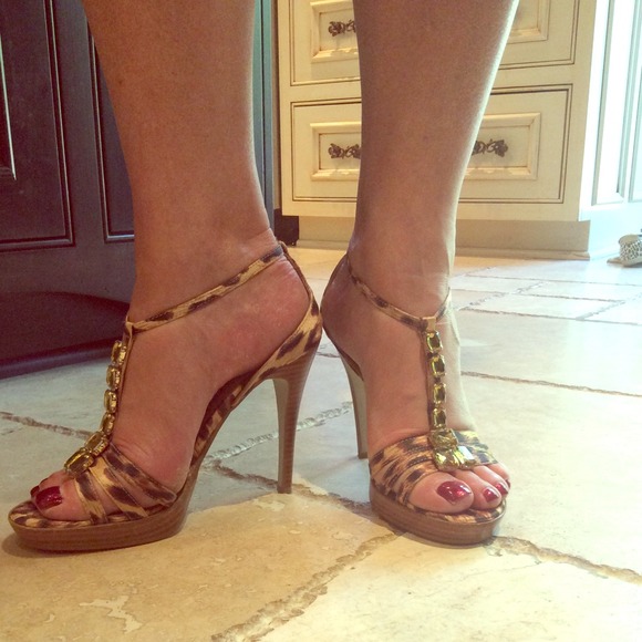Jeweled leopard print strappy sandals.
