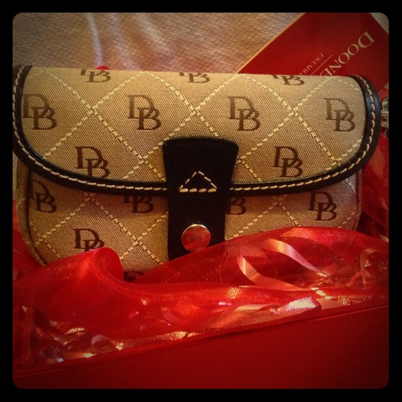 Brand new Dooney and Bourke Flap wristlet