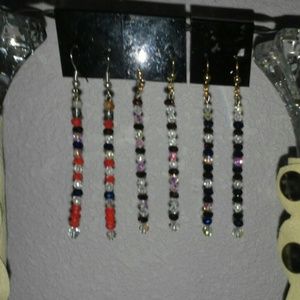 Earrings and leather ponytail holders