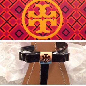 Tory Burch sandals with black bow.