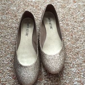 Gold sparkly flats