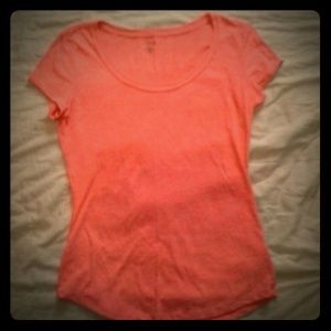 A peach scoop neck shirt