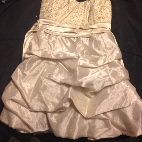 A gold thigh short dress. Size 5.