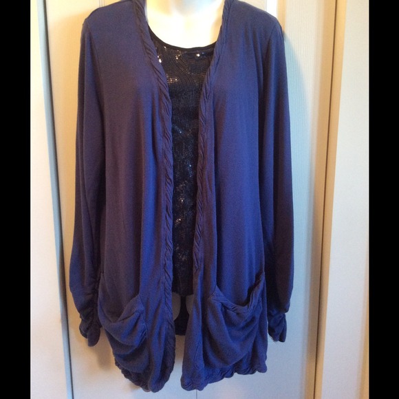 Open cardigan with cute details.
