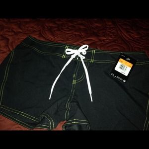 Nike beach black shorts with green trim