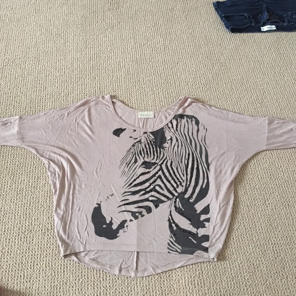 Light brown/beige blouse with zebra on it
