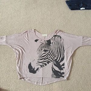 Light brown/beige blouse with zebra on it