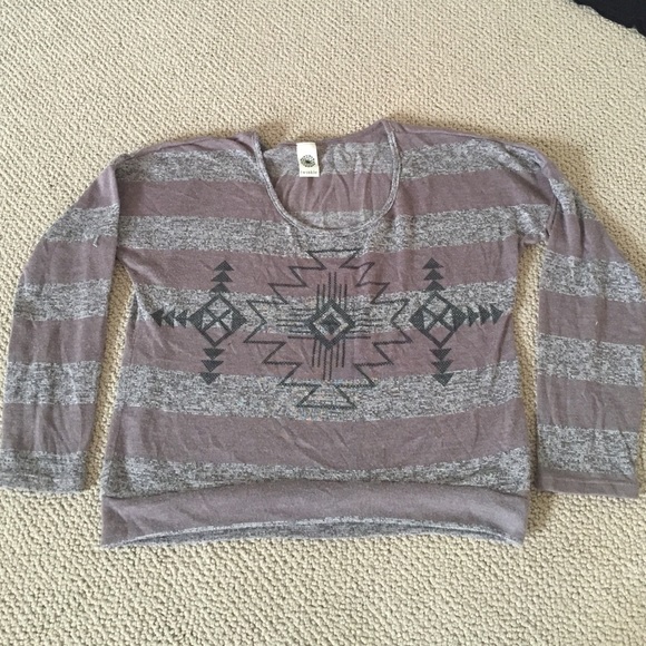 Long sleeve brown striped top with tribal design.