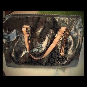 MK gun metal satchel with dust bag.