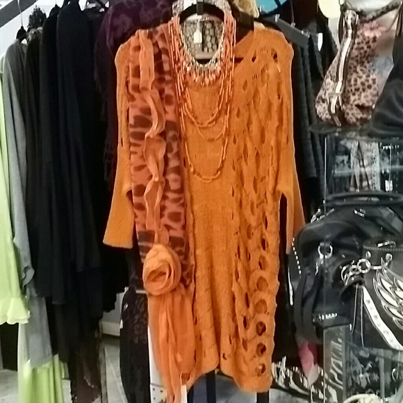 Orange tunic sweater with peek a boo holes