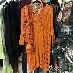 Orange tunic sweater with peek a boo holes