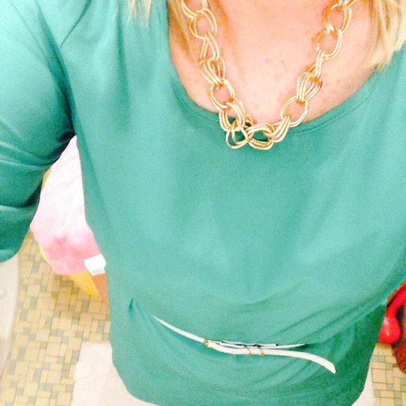 Jade green knee length dress.