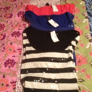 Tank tops bundle of three #2 and fits like a 0x.