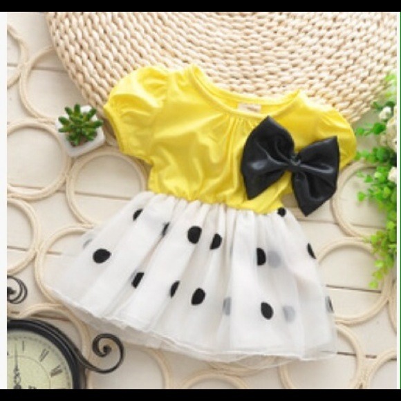 Yellow dress with black polka dots
