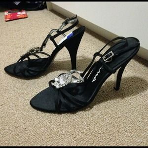 Black heels with diamond design.