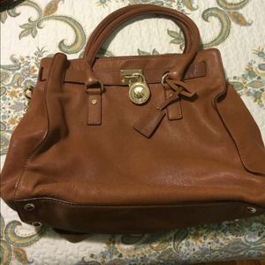 MK Hamilton. Tan gold hardware.