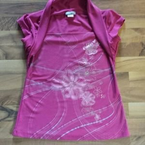 Women's dress shirt with design on front.