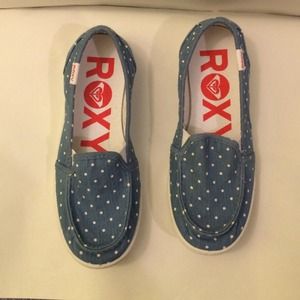Blue slip on shoes with white polka dots