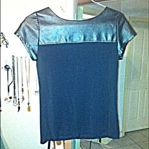 black faux leather shirt. W/ a zipper on the back