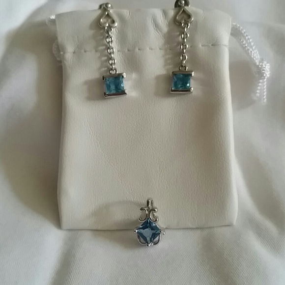 sterling silver and blue topaz pendant and earrin