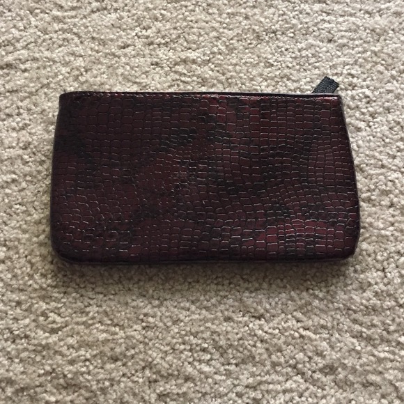 STEVE MADDEN faux reptile clutch.