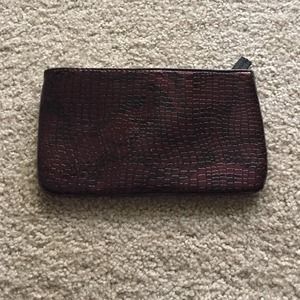 STEVE MADDEN faux reptile clutch.