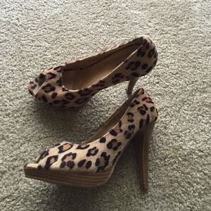 Faux leopard peep toe pumps