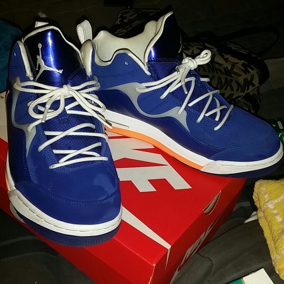 Men's orange blue and white Jordans, size 9.