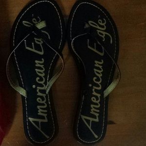 Black american eagle flip flops